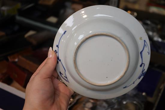 An 18th century Chinese blue and white tea bowl and saucer, and a similar bowl and two hardwood stands